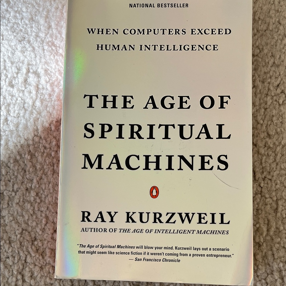 The Age of Spiritual Machines by Ray Kurzweil.

Paperback.

ISBN: 0-14-028202-5
